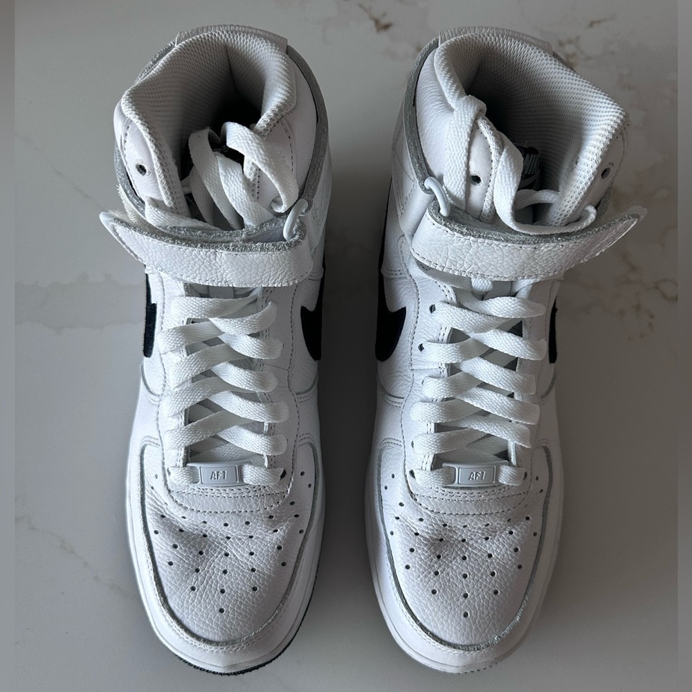 Nike High-Top Sneakers in White with Black Swoosh